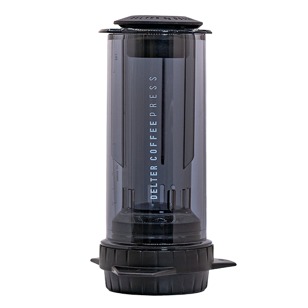 Delter Coffee Press with a bag of freshly ground coffee beans, ready to use